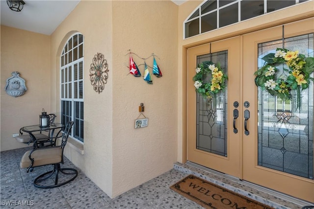 property entrance featuring french doors