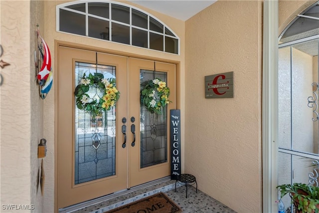 entrance to property featuring french doors