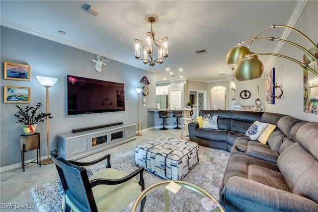 living area with ornamental molding, light tile patterned flooring, baseboards, and an inviting chandelier