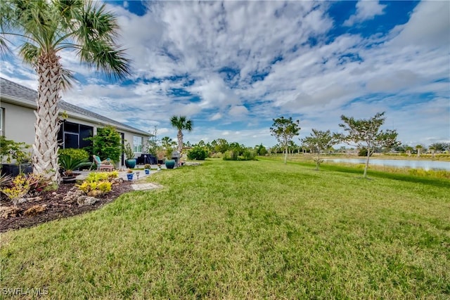 view of yard with a water view