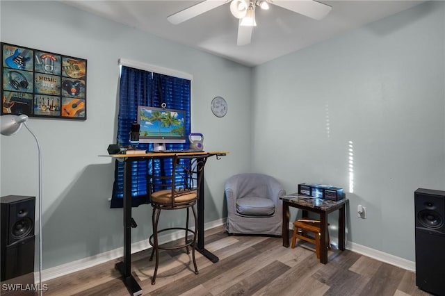 office with hardwood / wood-style flooring and ceiling fan