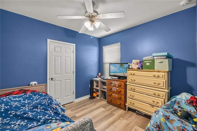 bedroom featuring ceiling fan and light hardwood / wood-style flooring