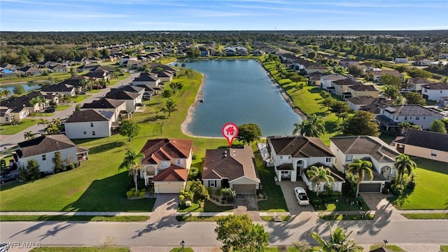 birds eye view of property with a water view