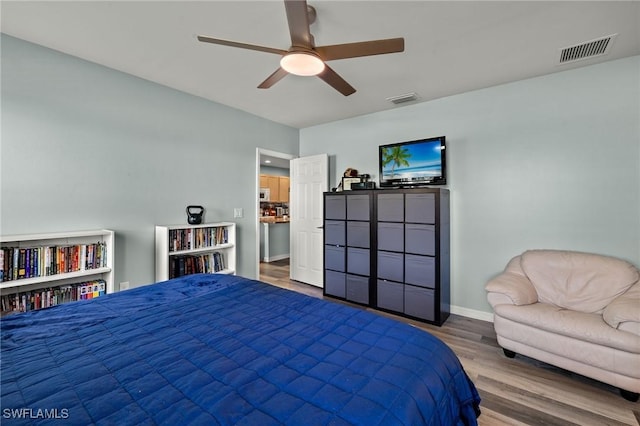 bedroom featuring hardwood / wood-style floors and ceiling fan