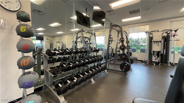 workout area featuring a paneled ceiling