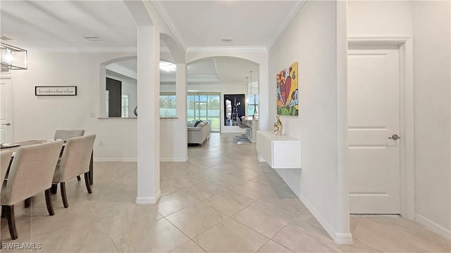 interior space featuring light tile patterned floors and crown molding