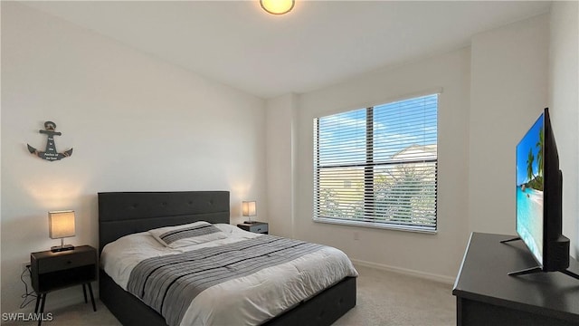 bedroom with light carpet