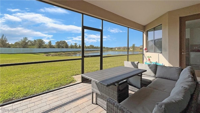 sunroom with a water view