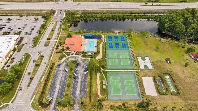 birds eye view of property with a water view