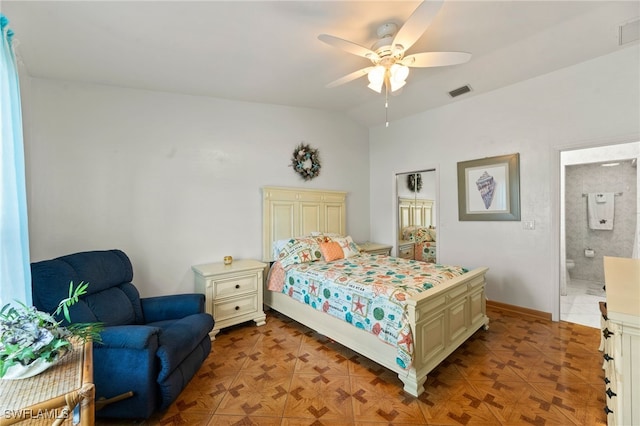 bedroom with vaulted ceiling, ensuite bath, and ceiling fan