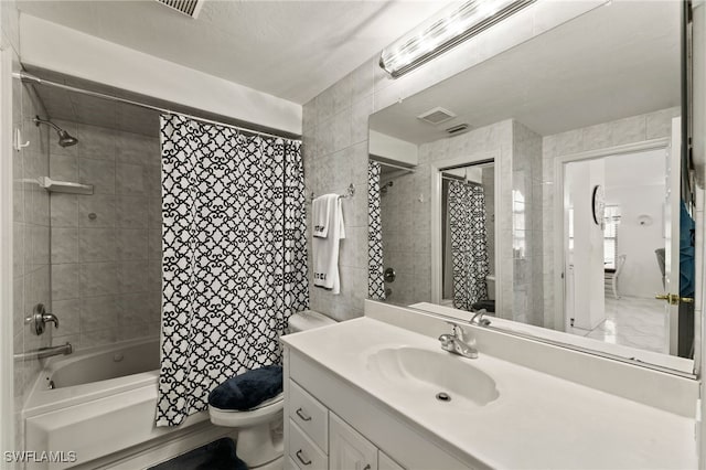 full bathroom with shower / bath combination with curtain, toilet, and vanity