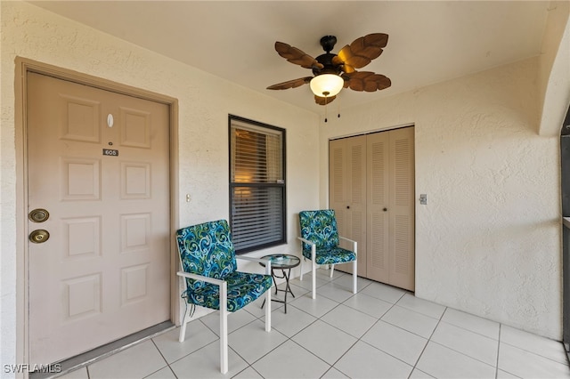 property entrance with ceiling fan and a patio area