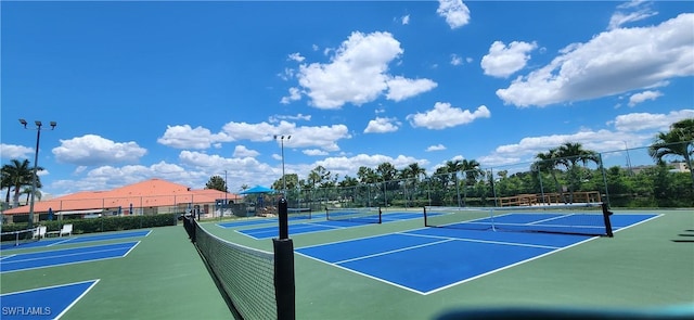 view of tennis court featuring basketball court