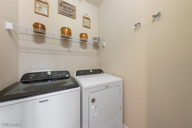 washroom with washer and dryer