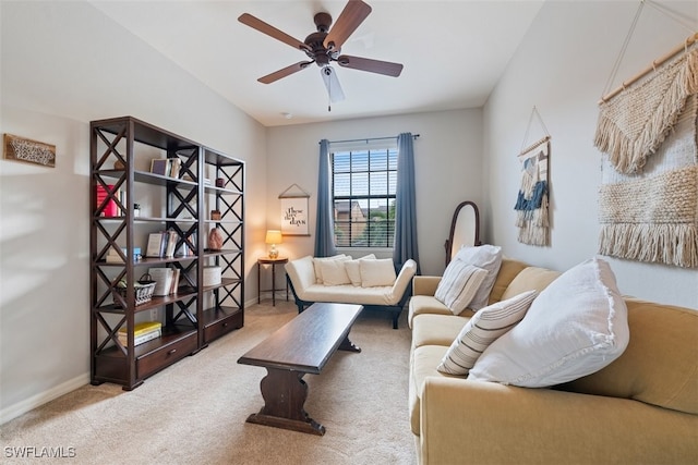 living room with ceiling fan and light colored carpet