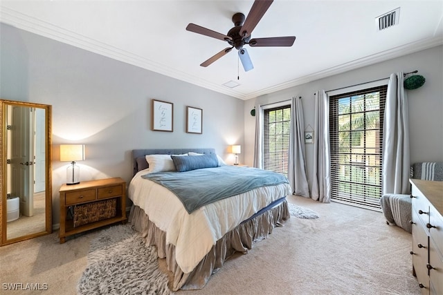 bedroom featuring a ceiling fan, light colored carpet, visible vents, and ornamental molding