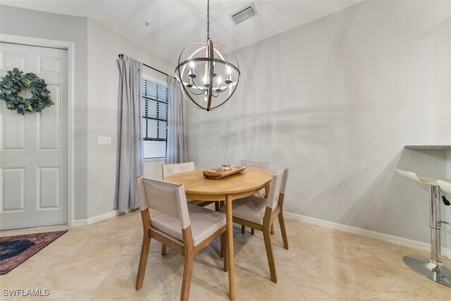 dining room with a notable chandelier