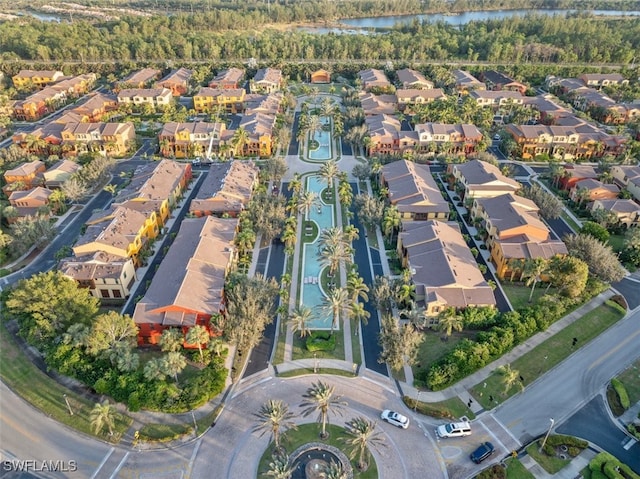 birds eye view of property with a residential view and a water view