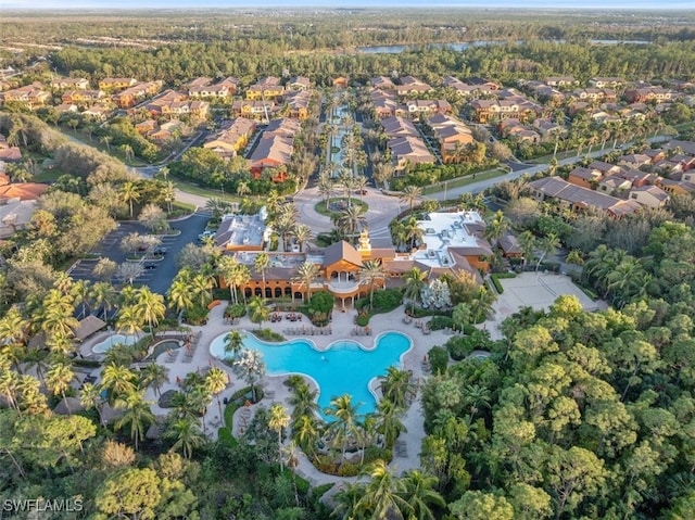 birds eye view of property with a wooded view and a residential view