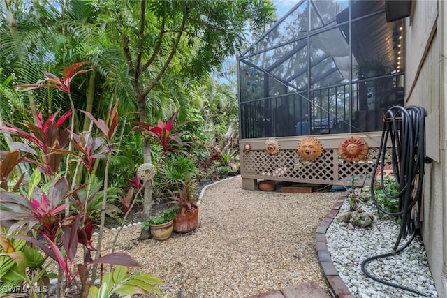 view of yard featuring a lanai