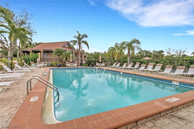 view of swimming pool with a patio area