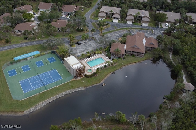 birds eye view of property with a water view