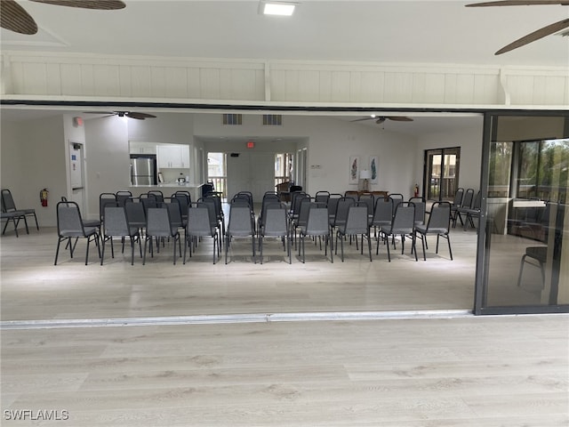 interior space with light hardwood / wood-style floors and ceiling fan