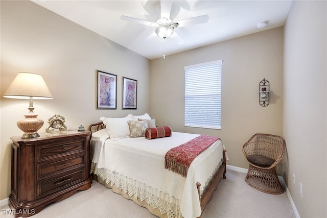 bedroom with light colored carpet and ceiling fan