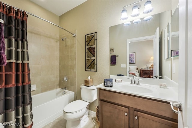 full bathroom with tile patterned flooring, vanity, toilet, and tiled shower / bath