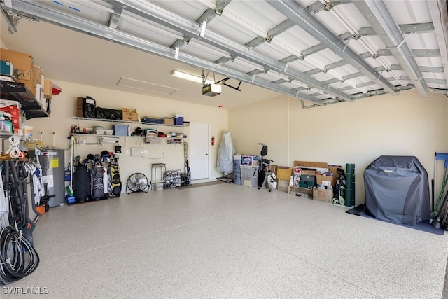 garage with electric water heater and a garage door opener