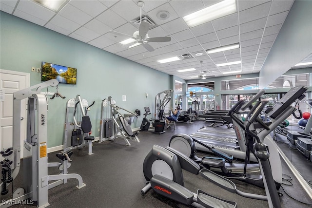 workout area featuring a paneled ceiling and ceiling fan