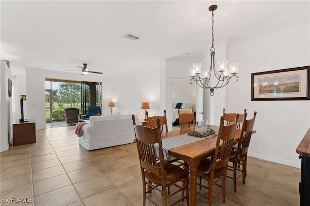 dining room with ceiling fan with notable chandelier and light tile patterned flooring