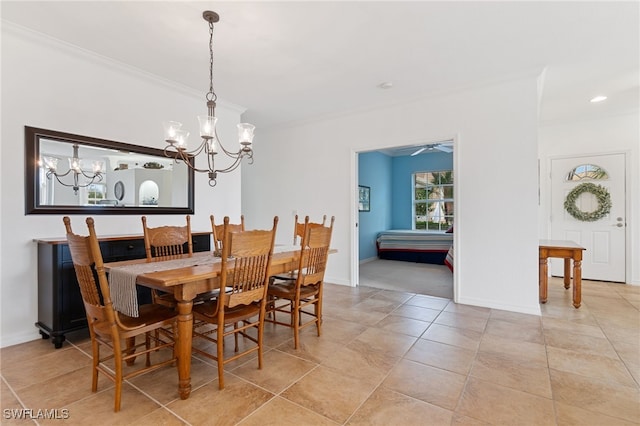 dining area with ornamental molding and ceiling fan with notable chandelier