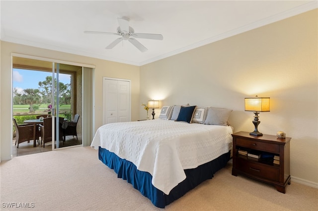 carpeted bedroom with crown molding, access to outside, ceiling fan, and a closet