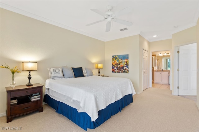 bedroom with connected bathroom, ceiling fan, crown molding, light carpet, and a closet