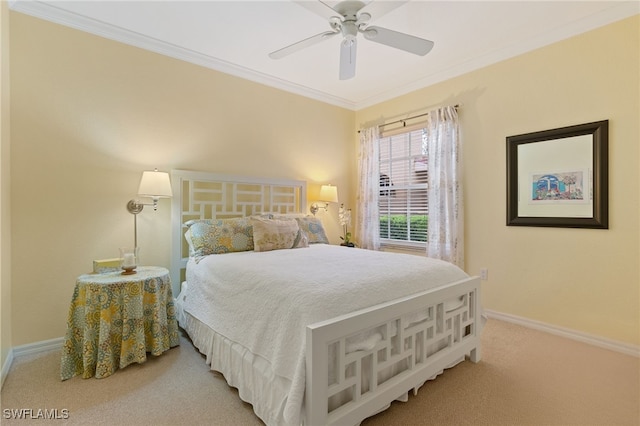 bedroom featuring crown molding, carpet floors, and ceiling fan