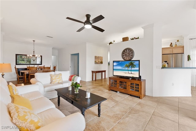 tiled living room with crown molding and ceiling fan with notable chandelier