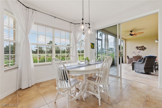 dining space with ceiling fan, light tile patterned floors, and a wealth of natural light