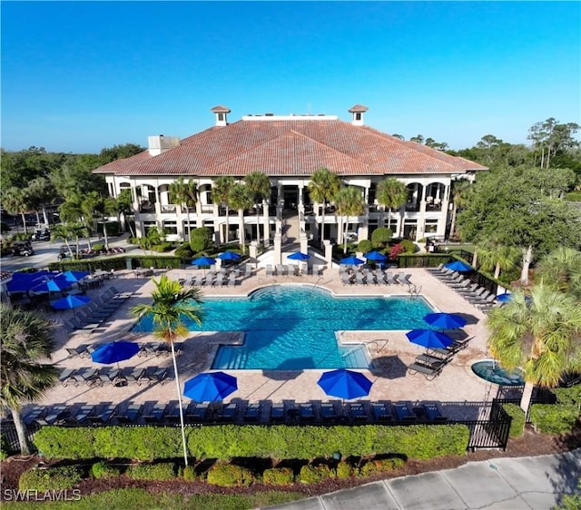 view of swimming pool with a patio area