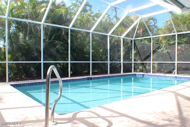 view of pool with a lanai