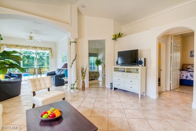 tiled living room with ceiling fan