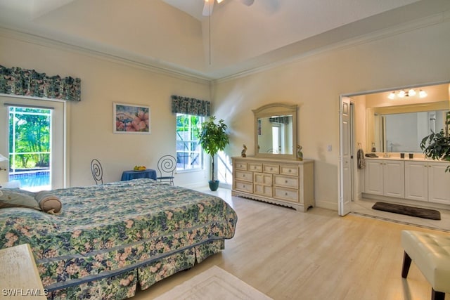 bedroom with access to exterior, multiple windows, and ceiling fan