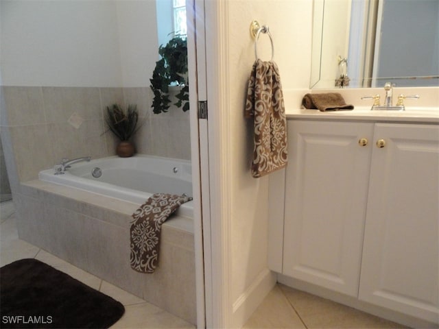 bathroom with vanity, tiled bath, and tile patterned floors