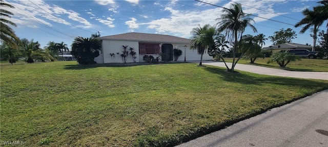 ranch-style home with a front yard