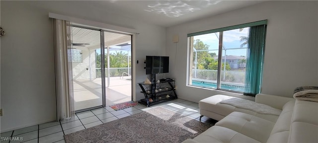 living room with light tile patterned floors and a healthy amount of sunlight