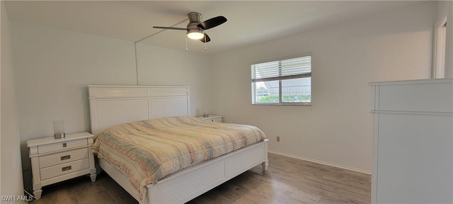 bedroom featuring ceiling fan and dark wood-type flooring