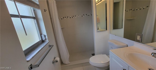 bathroom featuring curtained shower, tile patterned flooring, vanity, and toilet