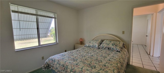 bedroom with light tile patterned flooring