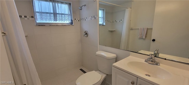 bathroom featuring a shower with curtain, vanity, and toilet