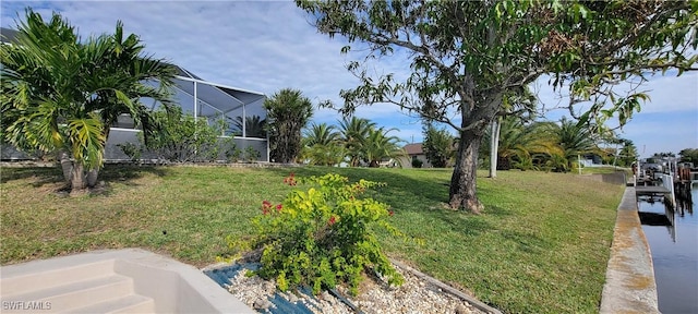 view of yard with glass enclosure